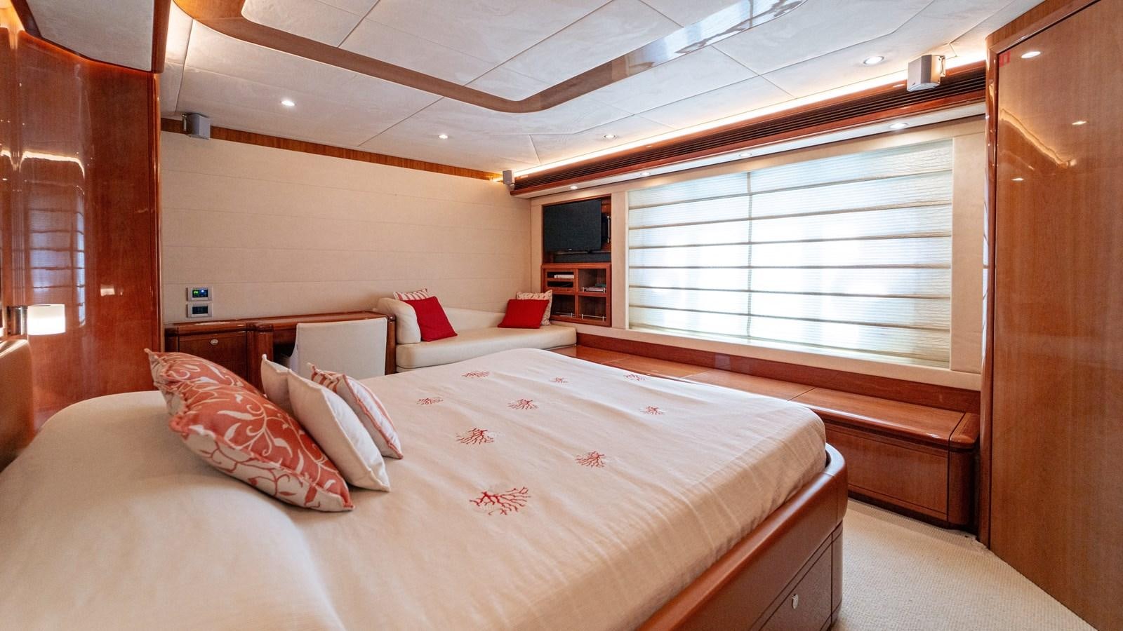 a room with a bed and a window aboard LADY HELENA Yacht for Sale