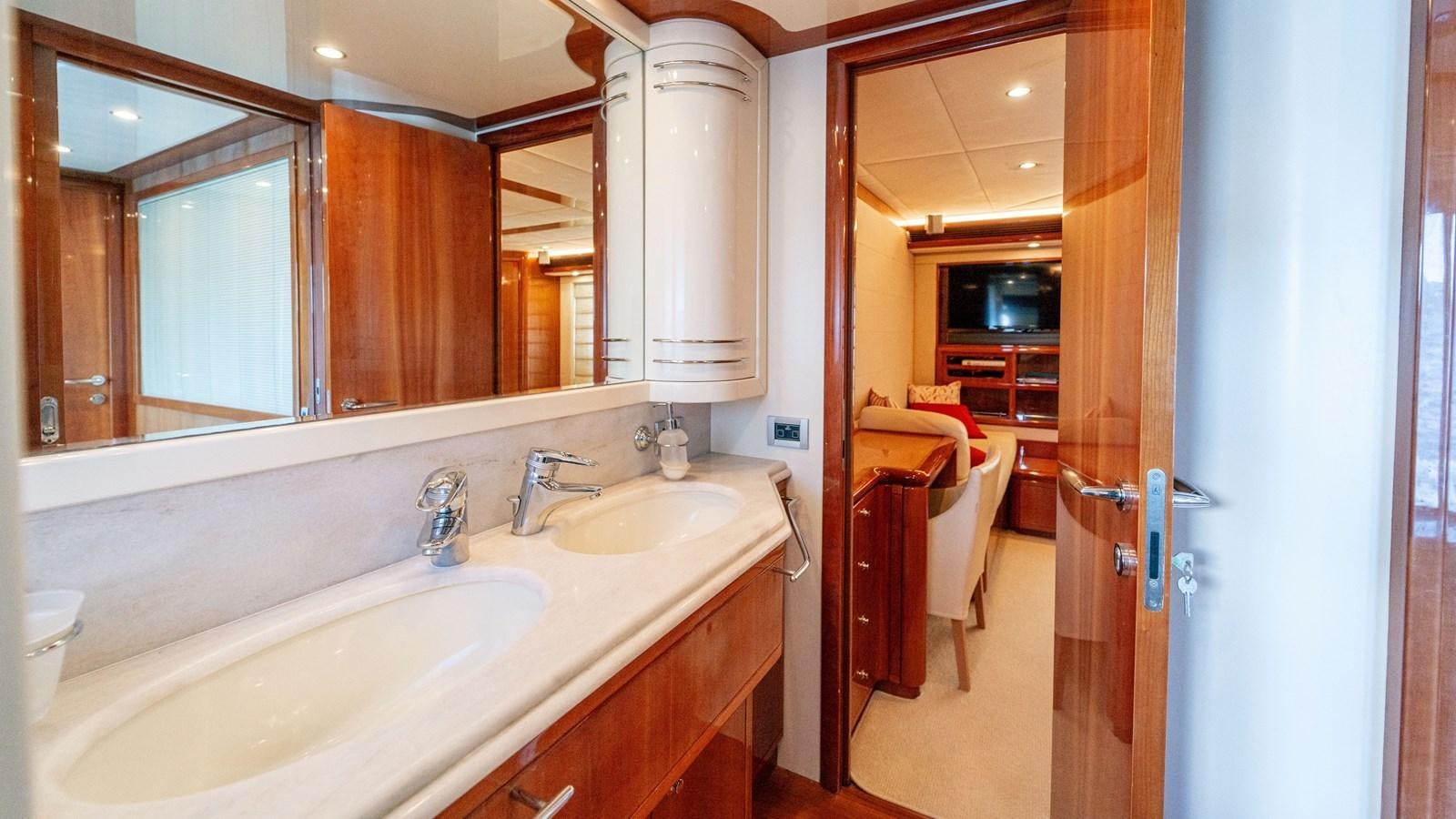 a bathroom with a large mirror aboard LADY HELENA Yacht for Sale
