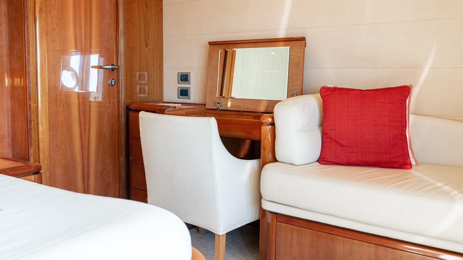 a room with a bed and a mirror aboard LADY HELENA Yacht for Sale