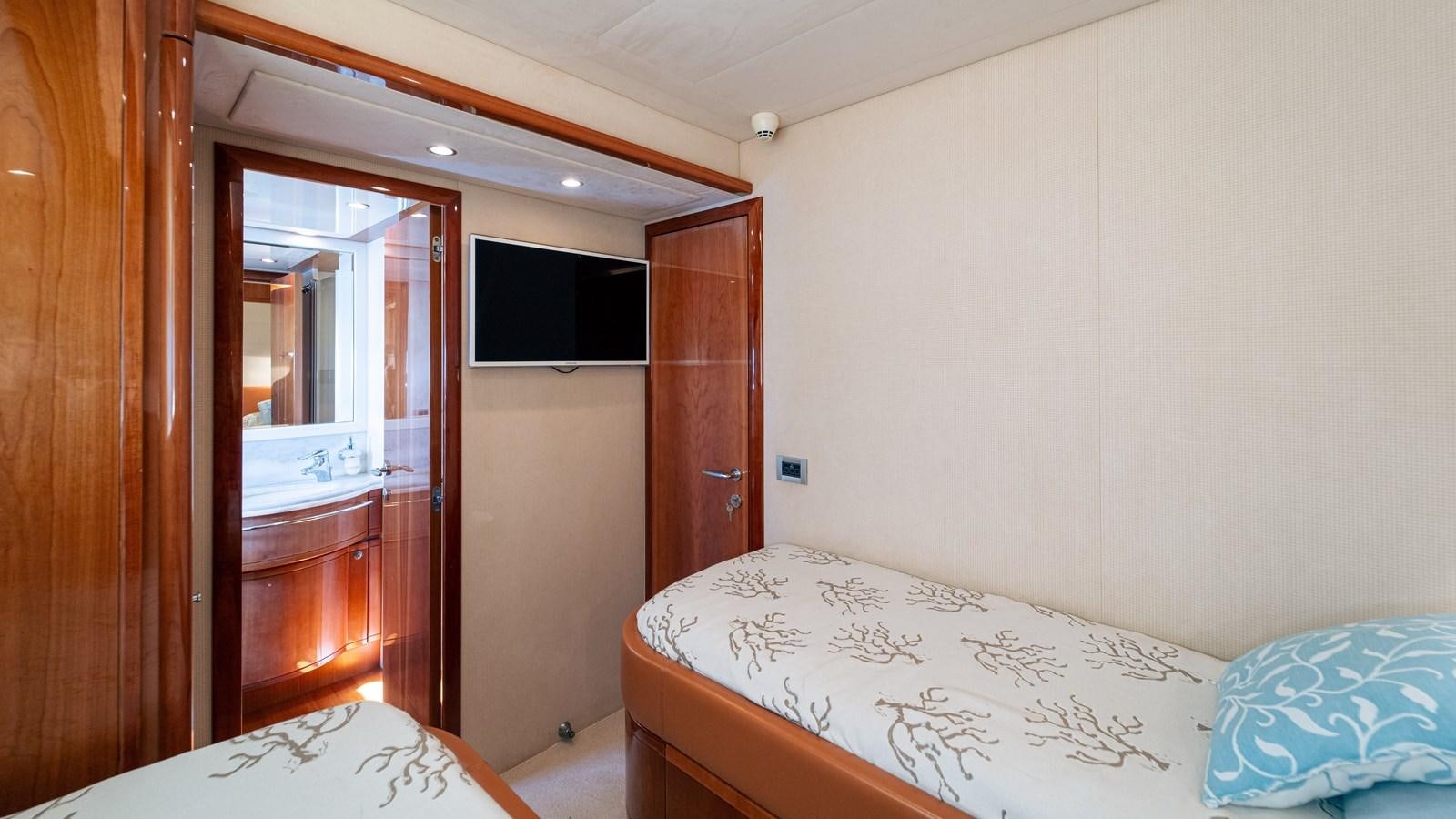 a bedroom with a bed and a closet aboard LADY HELENA Yacht for Sale