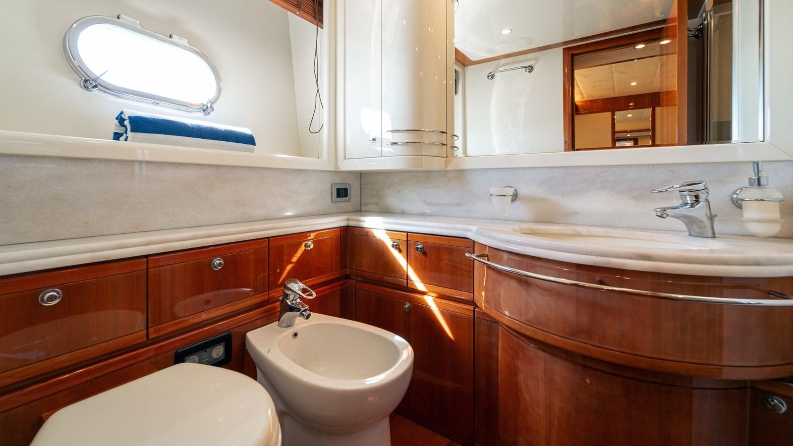 a bathroom with a sink and a toilet aboard LADY HELENA Yacht for Sale