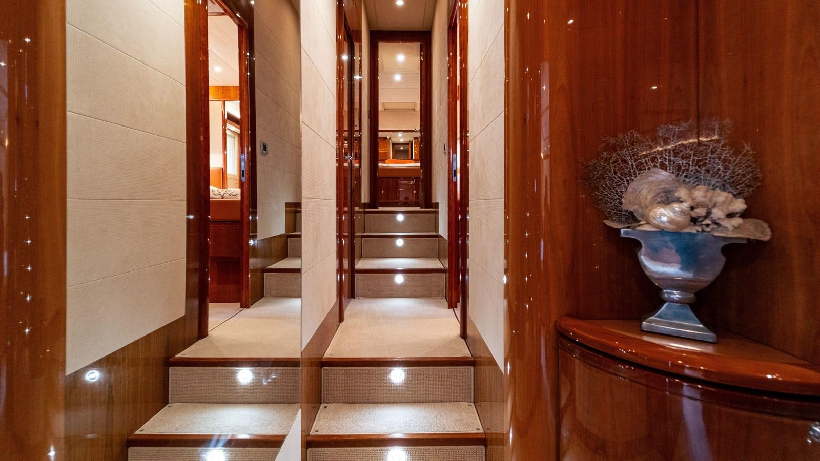 a room with a vase and a statue in it aboard LADY HELENA Yacht for Sale