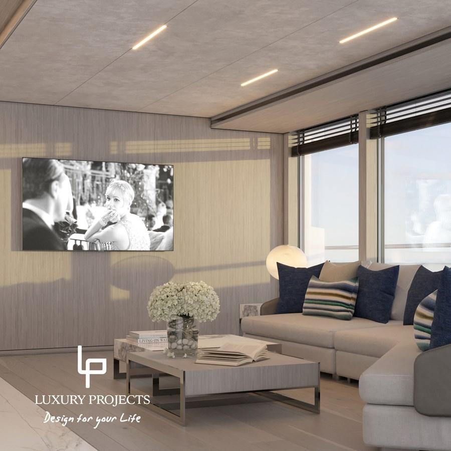 a living room with a large screen aboard SPACELINE 88 Yacht for Sale