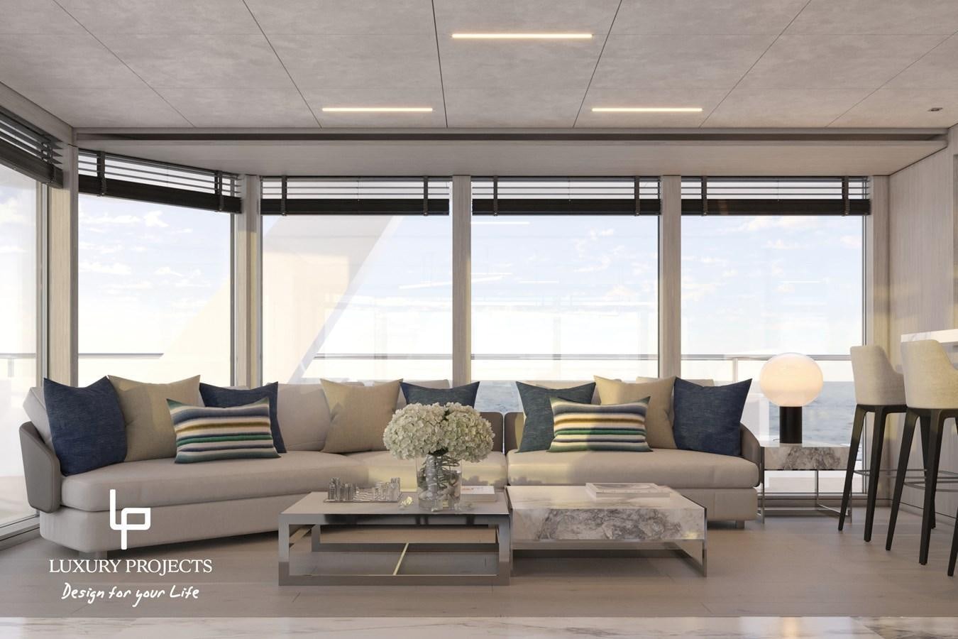 a living room with a couch and a coffee table aboard SPACELINE 88 Yacht for Sale