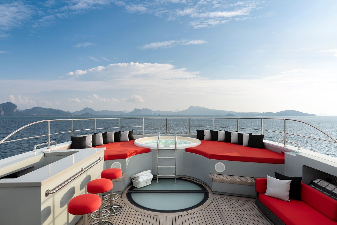 a room with a view of the ocean and the land below aboard OCEAN EMERALD Yacht for Sale