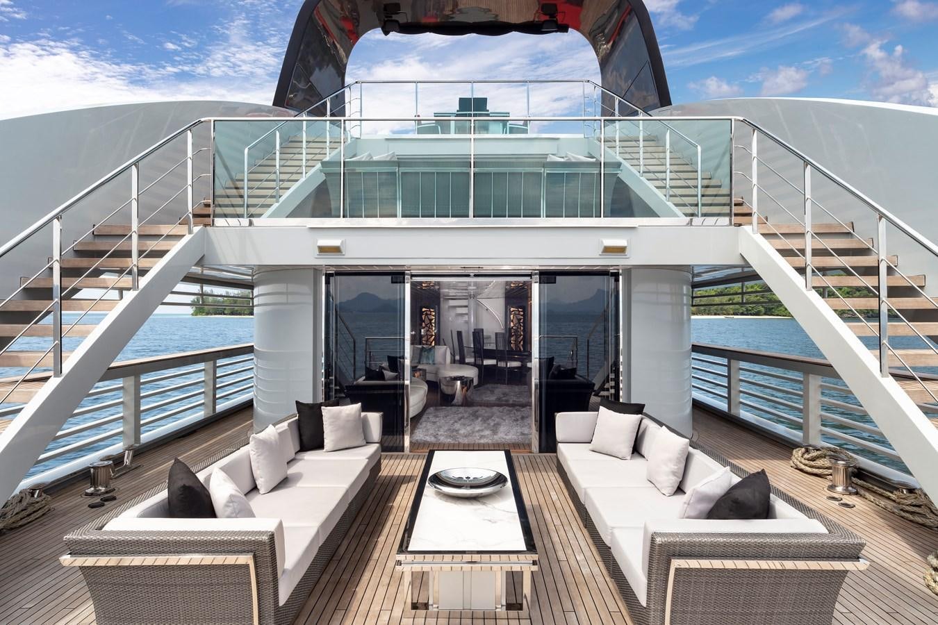 a large balcony overlooking a beach aboard OCEAN EMERALD Yacht for Sale