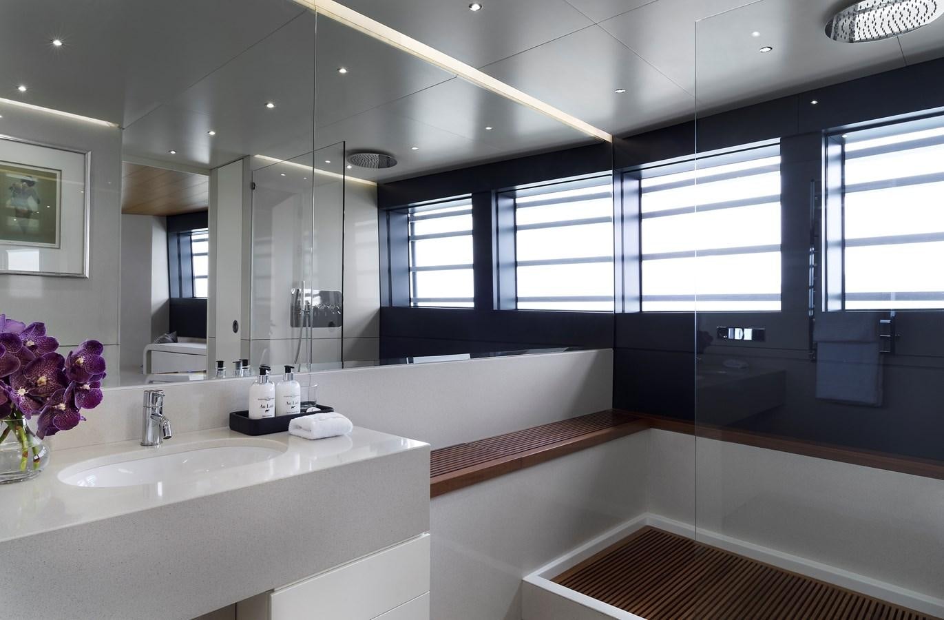 a bathroom with a sink and a mirror aboard OCEAN EMERALD Yacht for Sale
