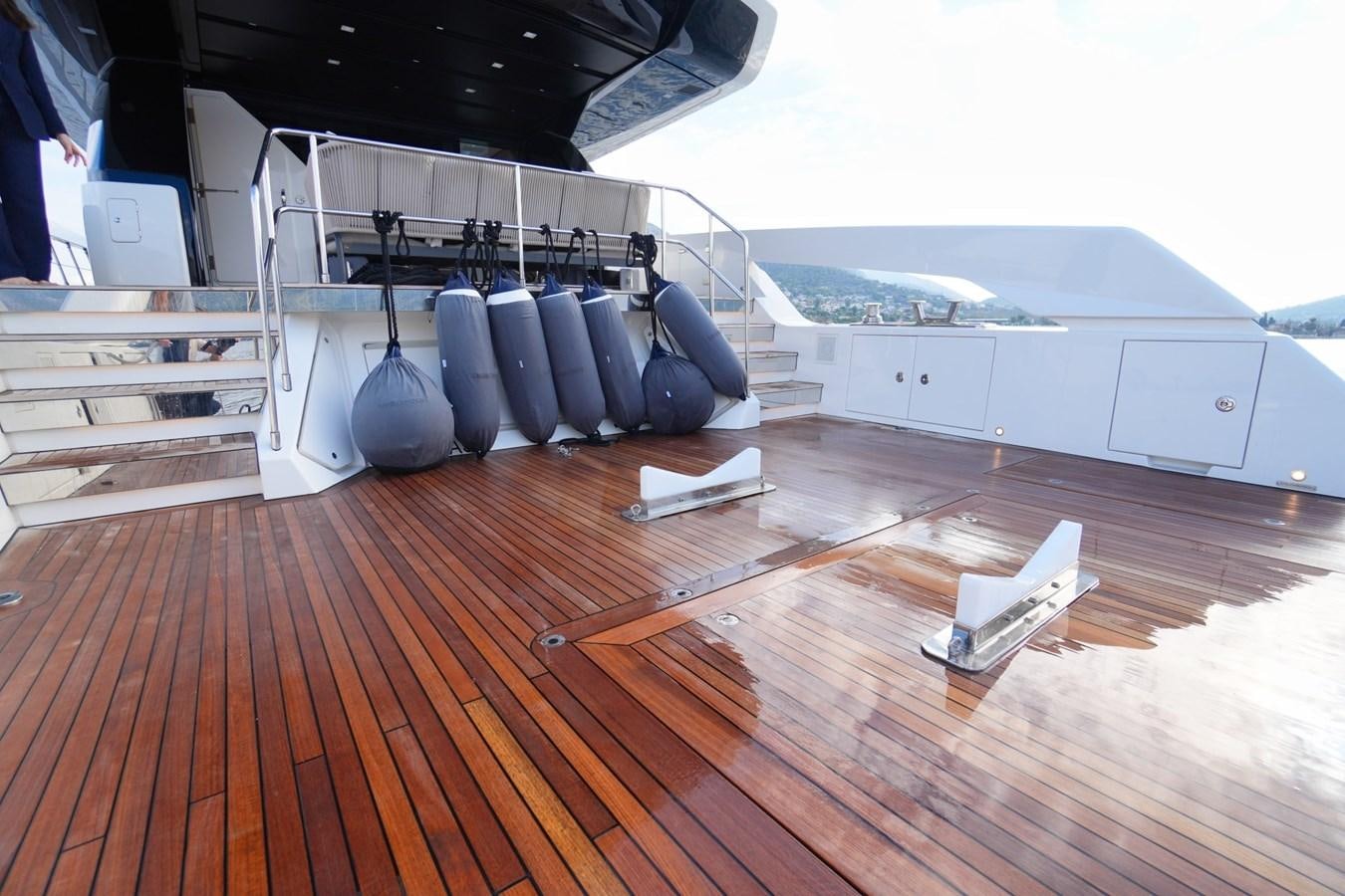 a room with a wood floor and a large machine on the side aboard LOVE IS IN THE AIR Yacht for Sale