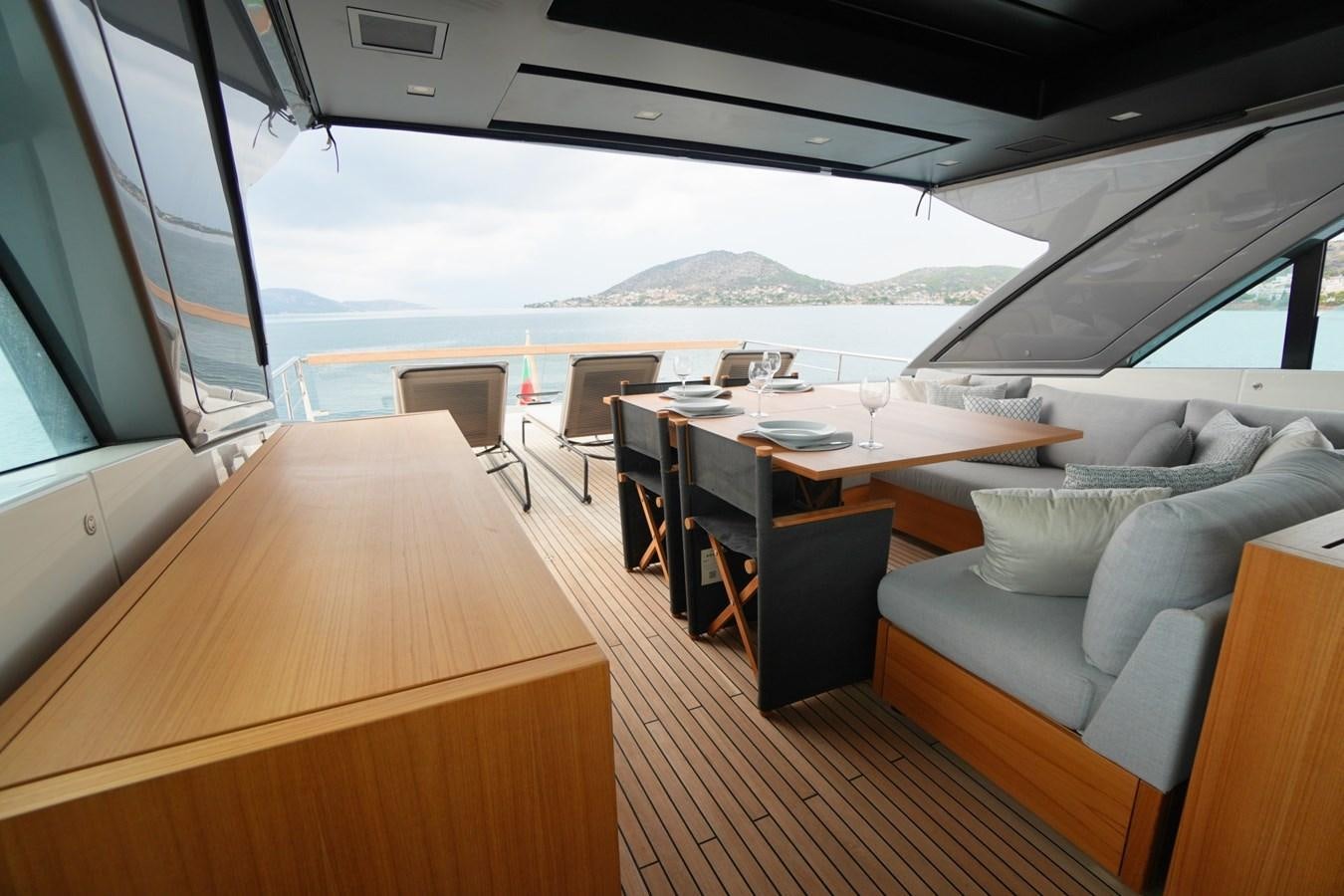 a room with a table and chairs aboard LOVE IS IN THE AIR Yacht for Sale