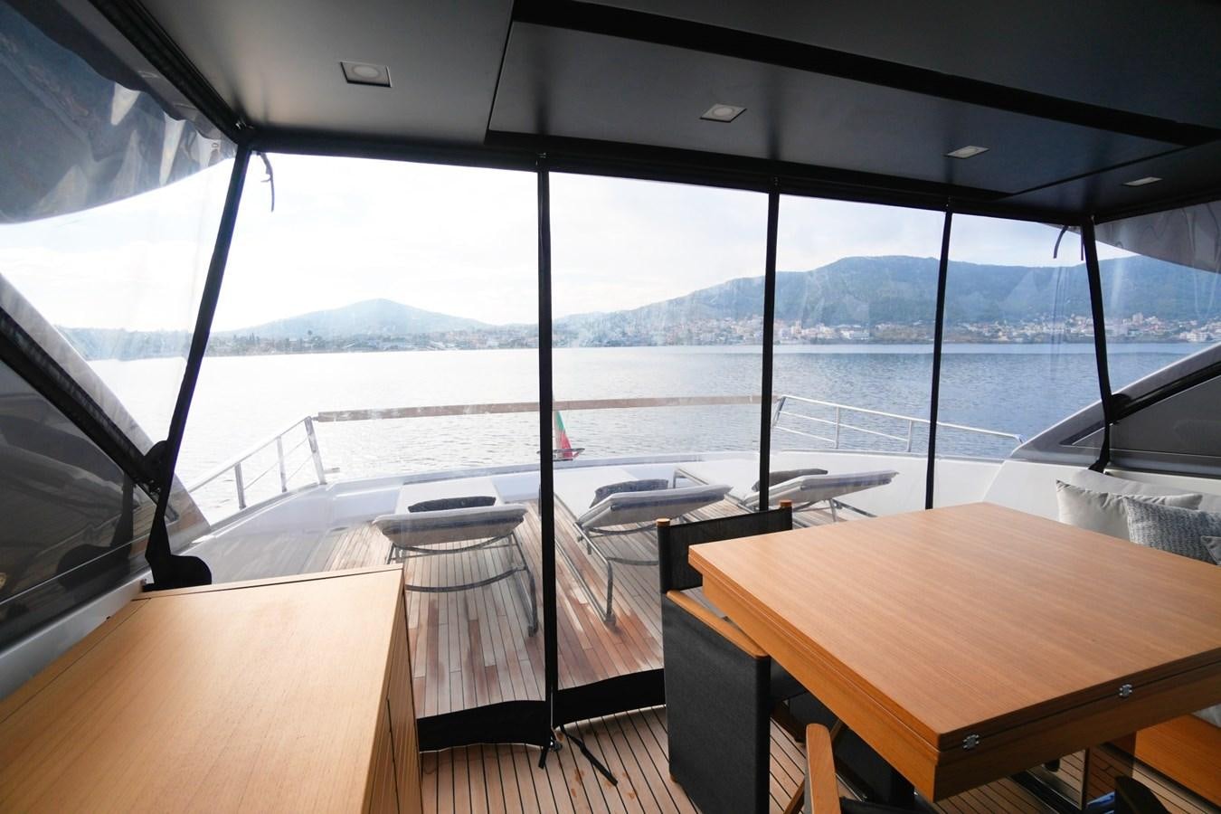 a room with a table and chairs aboard LOVE IS IN THE AIR Yacht for Sale