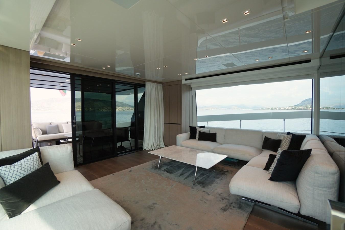 a living room with a large window aboard LOVE IS IN THE AIR Yacht for Sale