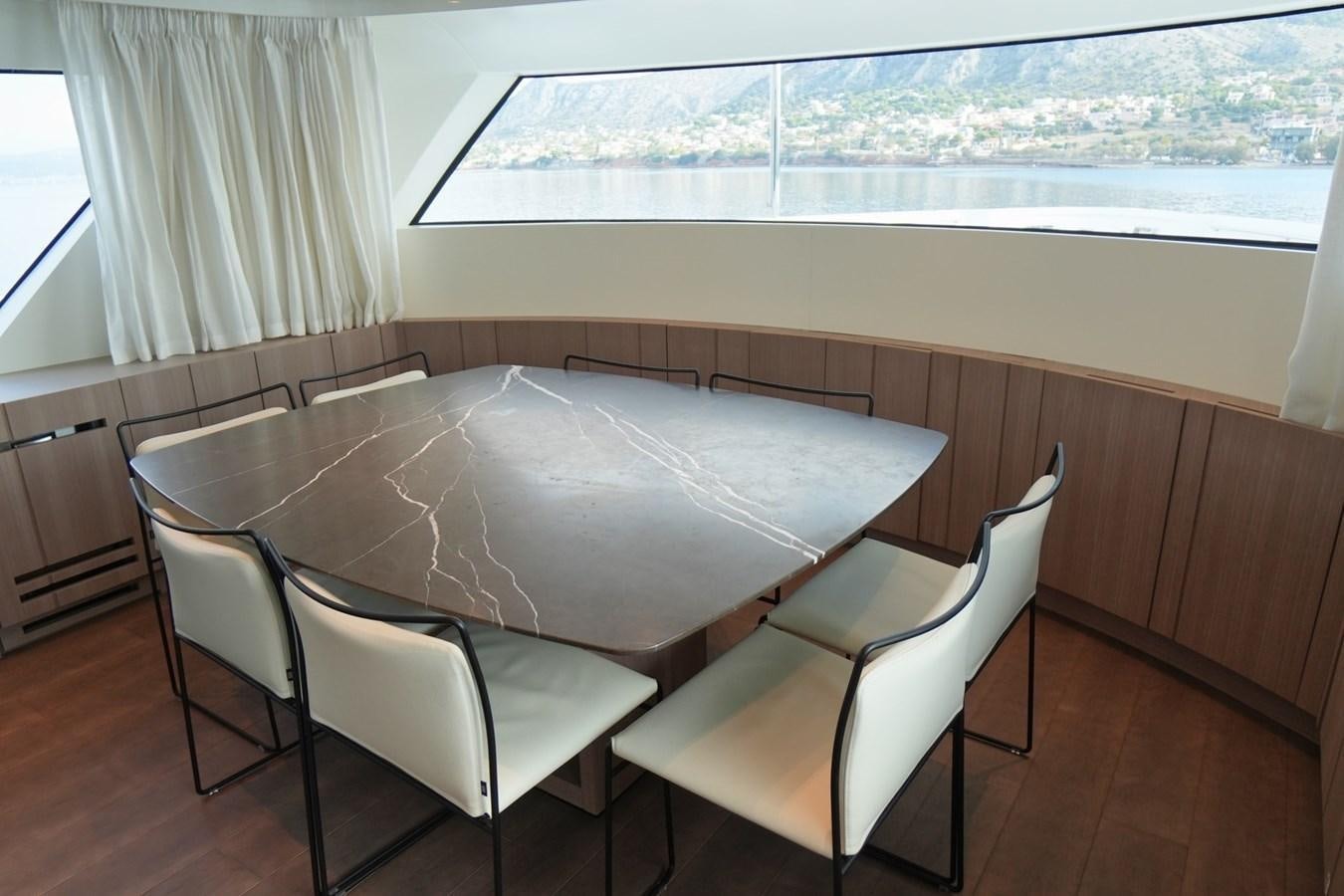 a table and chairs in a room aboard LOVE IS IN THE AIR Yacht for Sale