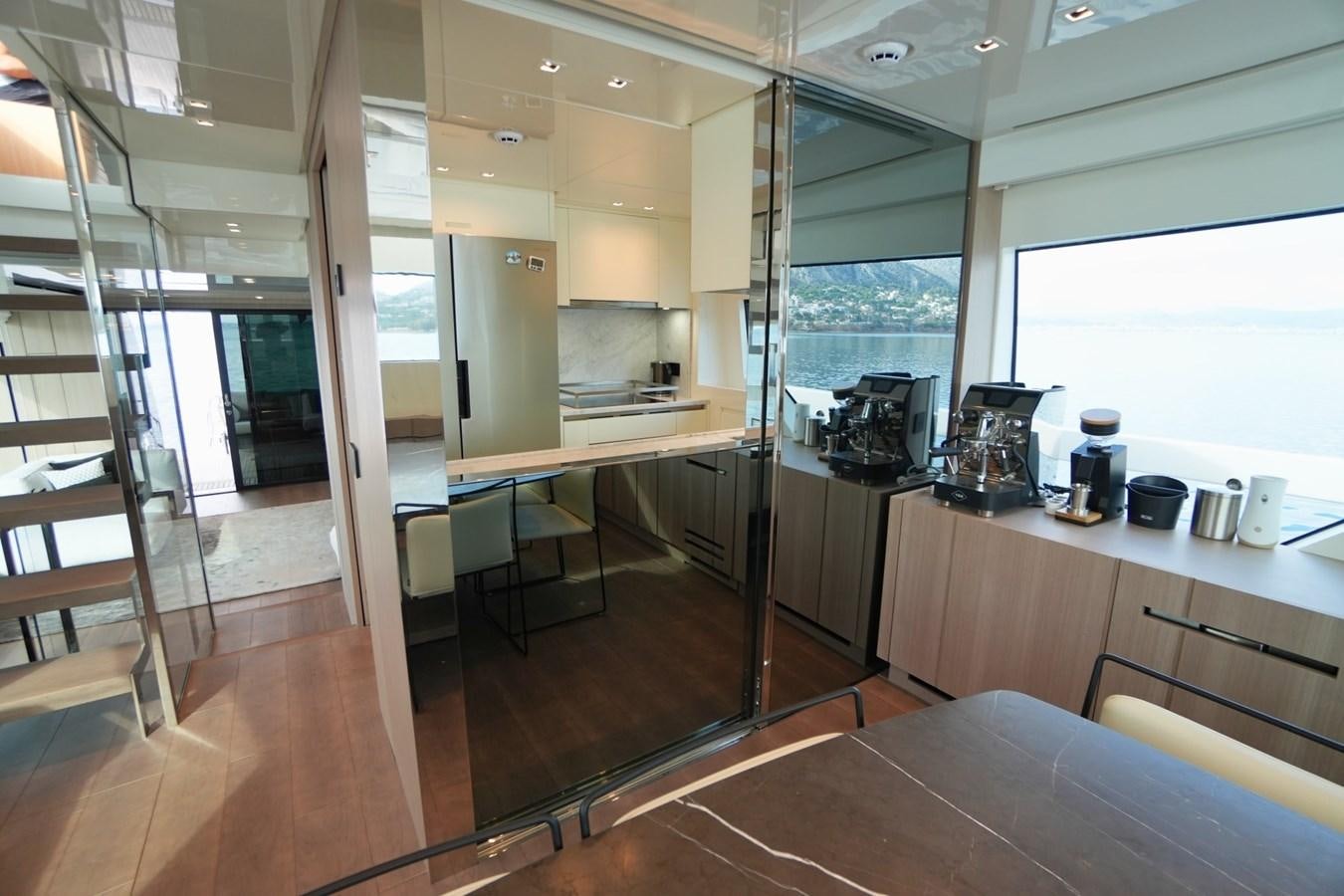 a room with a wood floor and a large window aboard LOVE IS IN THE AIR Yacht for Sale