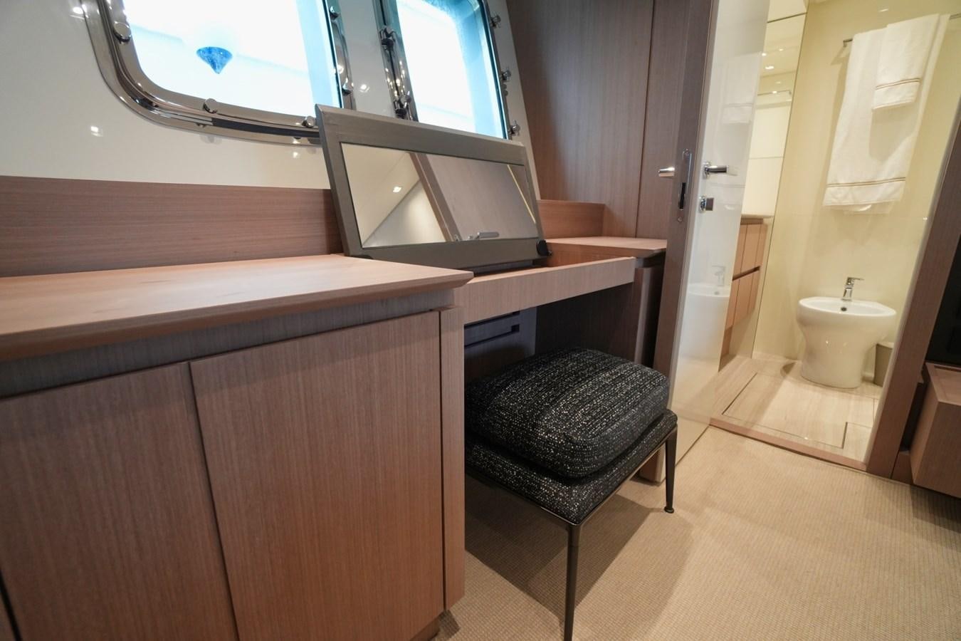 a bathroom with a stool and a mirror aboard LOVE IS IN THE AIR Yacht for Sale
