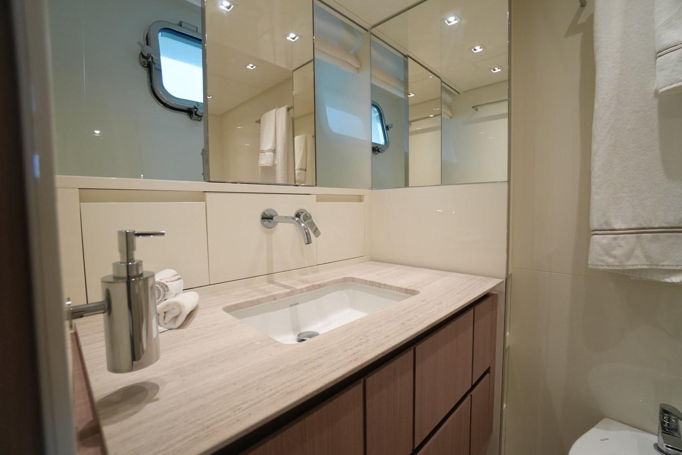 a bathroom with a large mirror aboard LOVE IS IN THE AIR Yacht for Sale