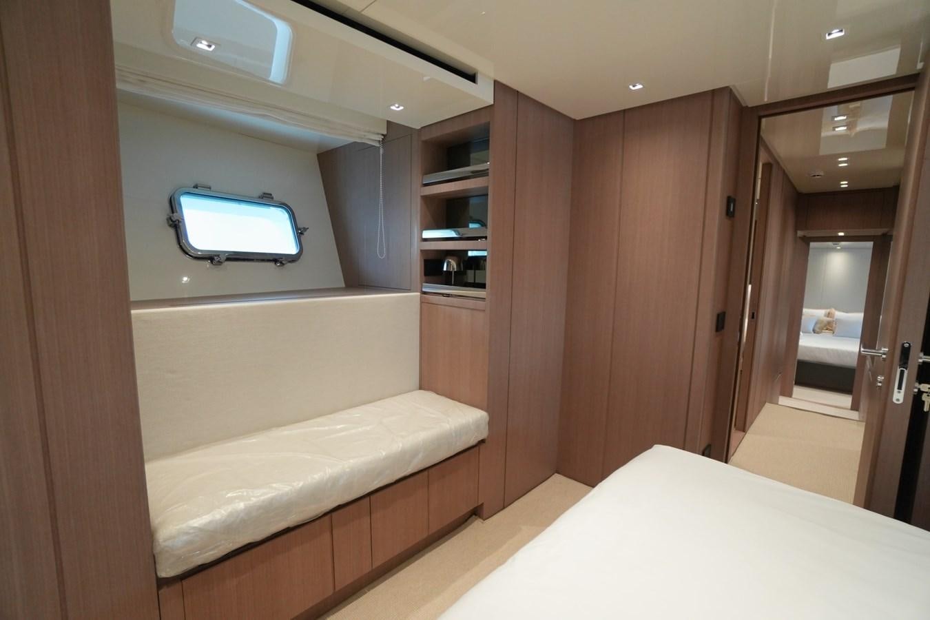 a room with a bed and a closet aboard LOVE IS IN THE AIR Yacht for Sale
