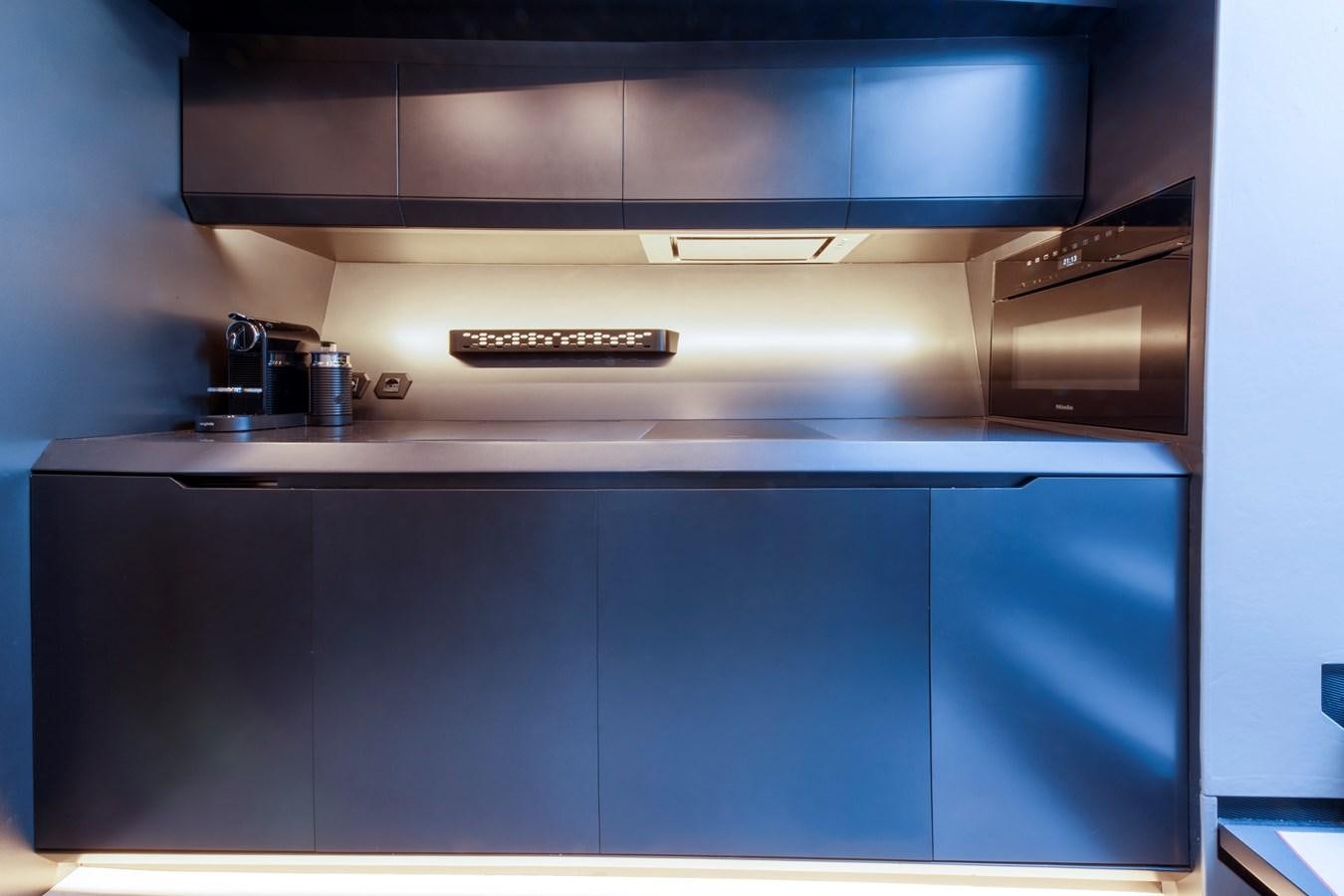 a kitchen with a silver oven aboard FAST ONE Yacht for Sale