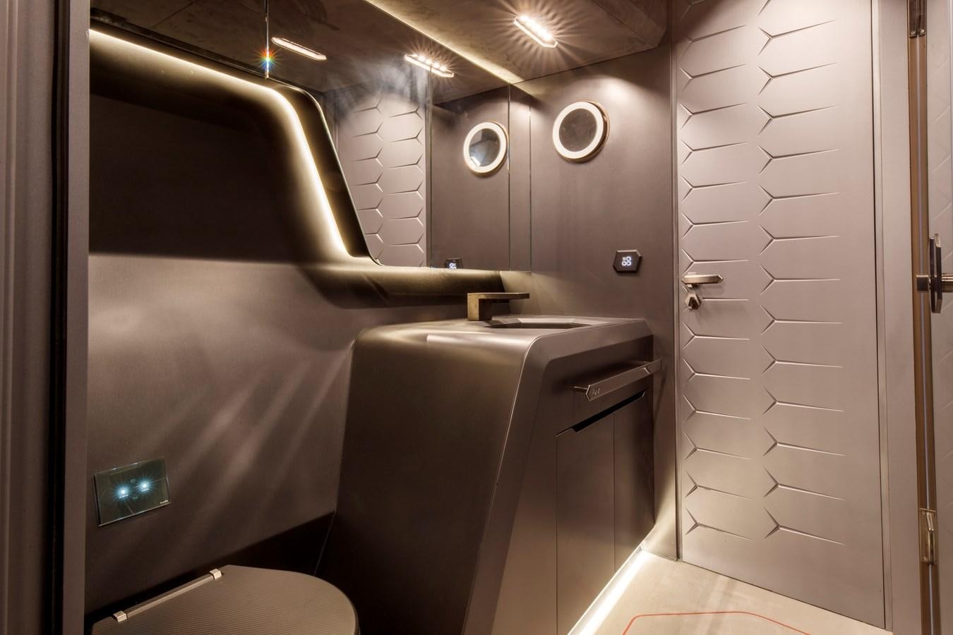 a bathroom with a toilet and a shower aboard FAST ONE Yacht for Sale