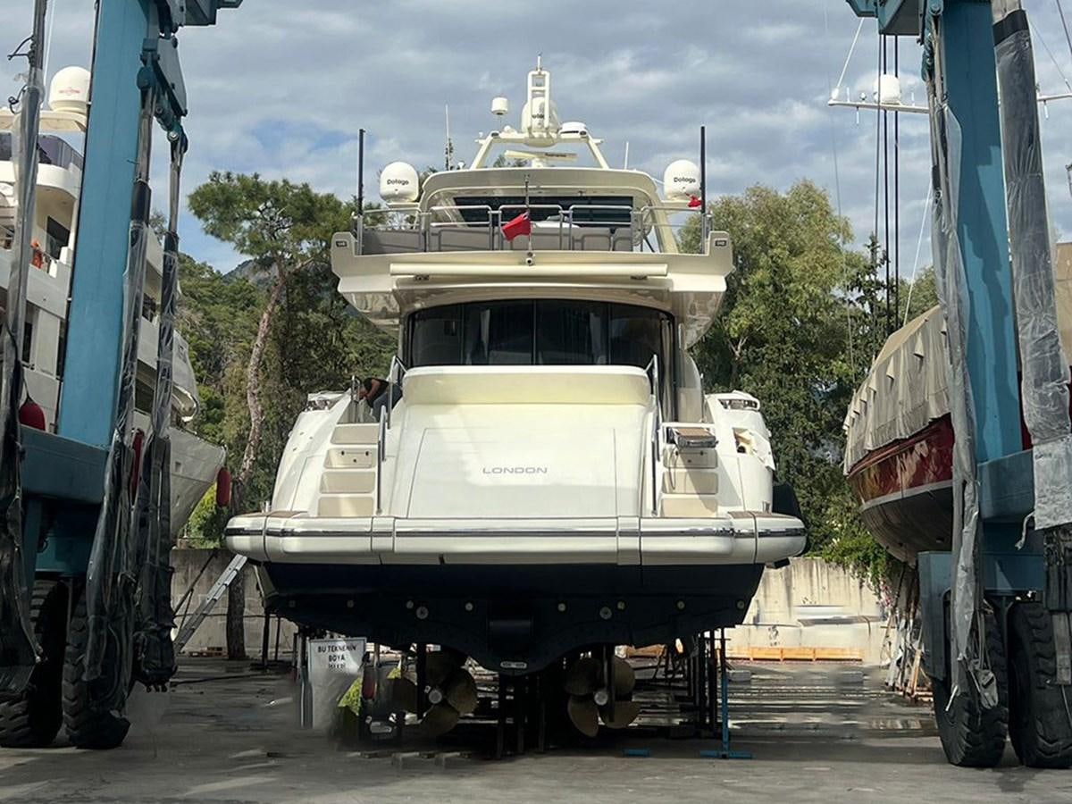 a large white boat on a trailer aboard AZIMUT 98 2009 Yacht for Sale