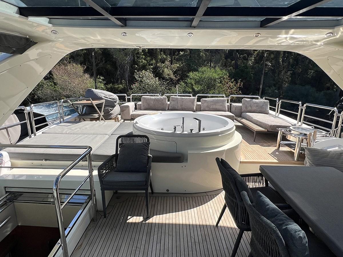 a large white table with chairs around it aboard AZIMUT 98 2009 Yacht for Sale