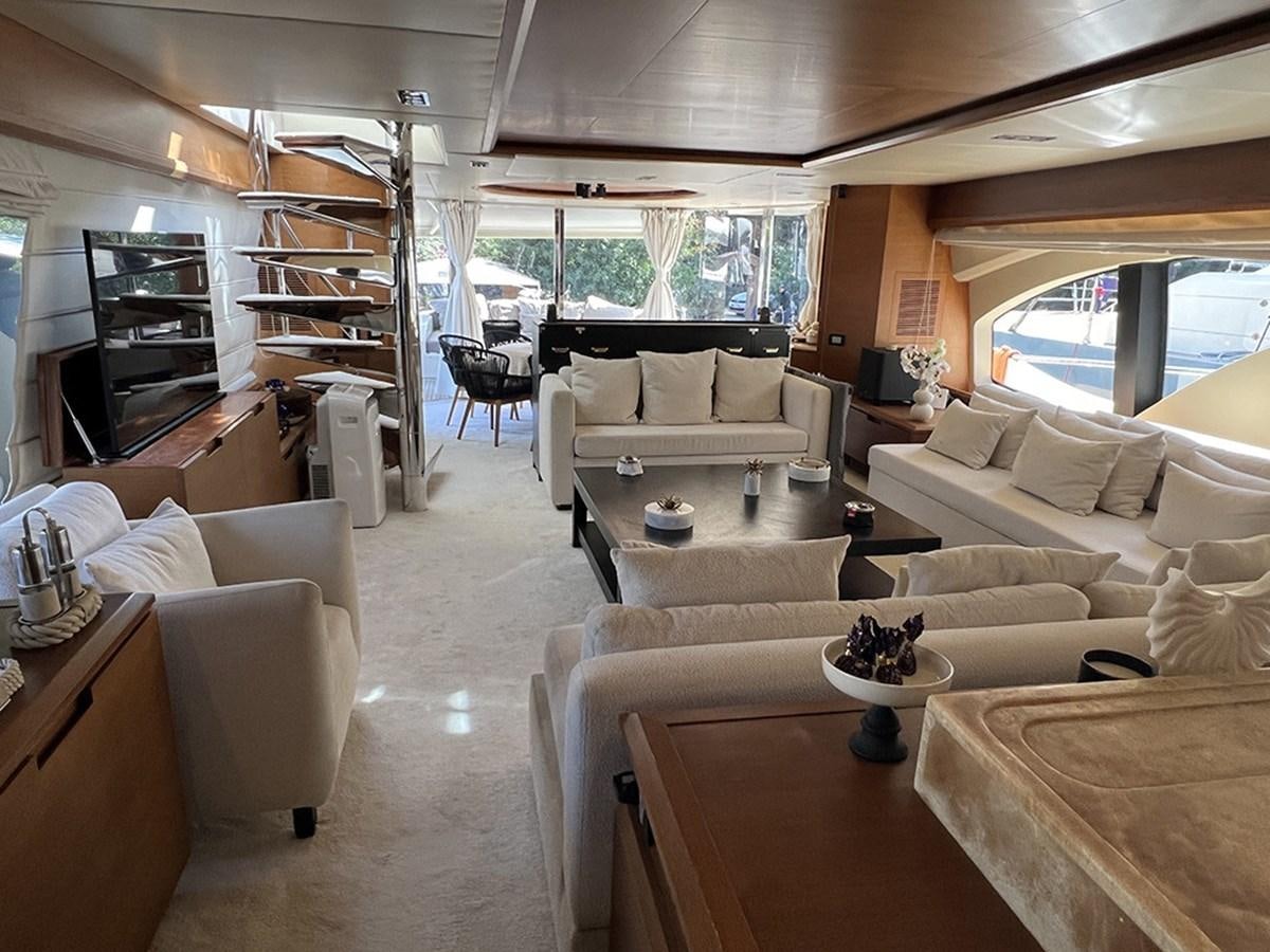 a living room with a couch and a table aboard AZIMUT 98 2009 Yacht for Sale