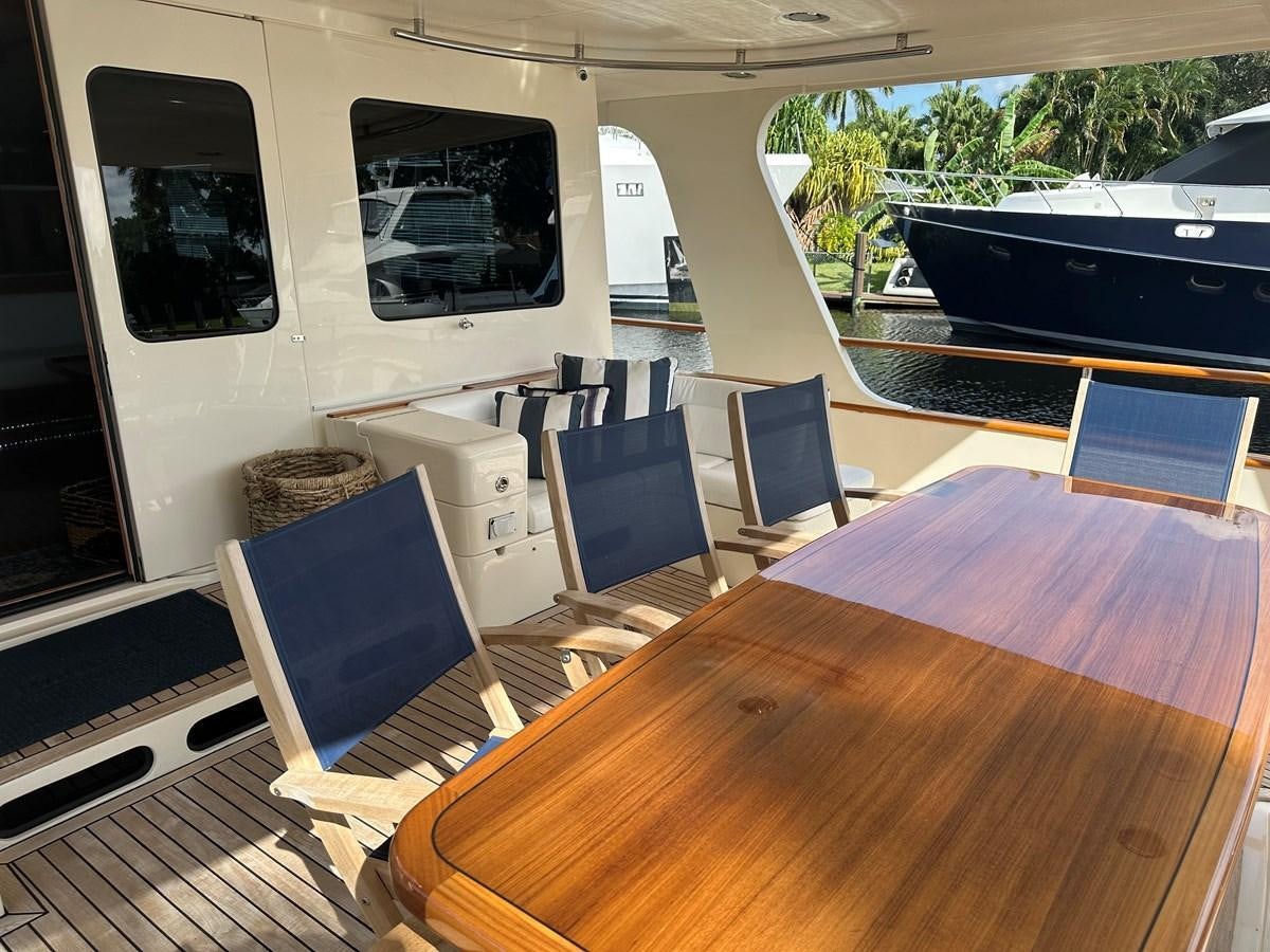 a room with a table and chairs aboard BANDOL Yacht for Sale
