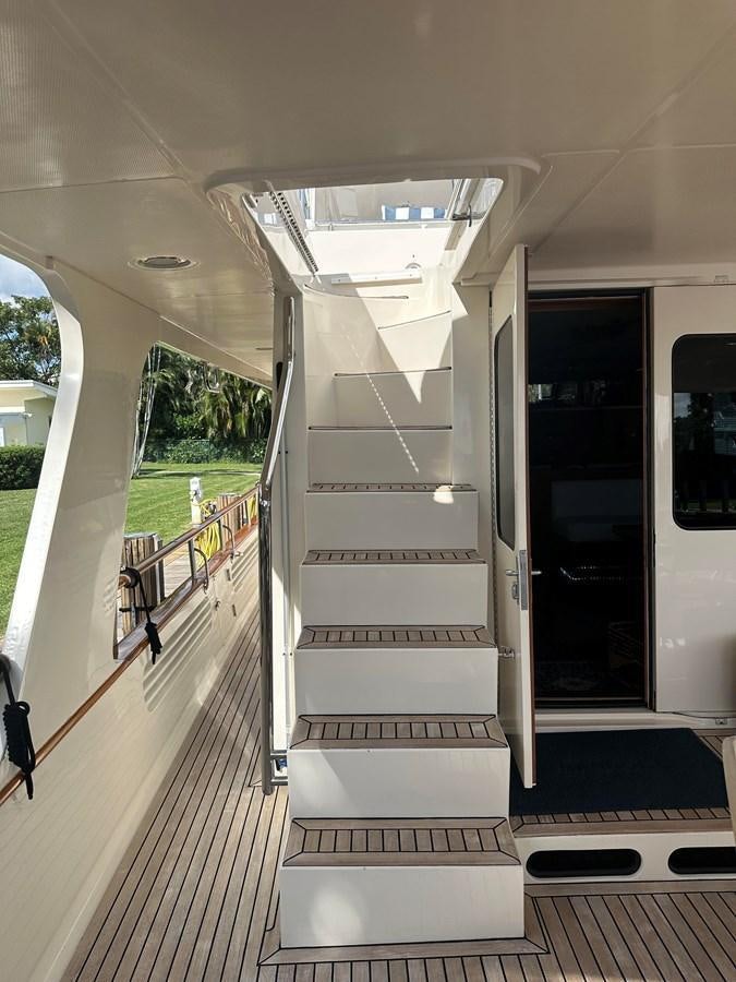 a long hallway with a door aboard BANDOL Yacht for Sale