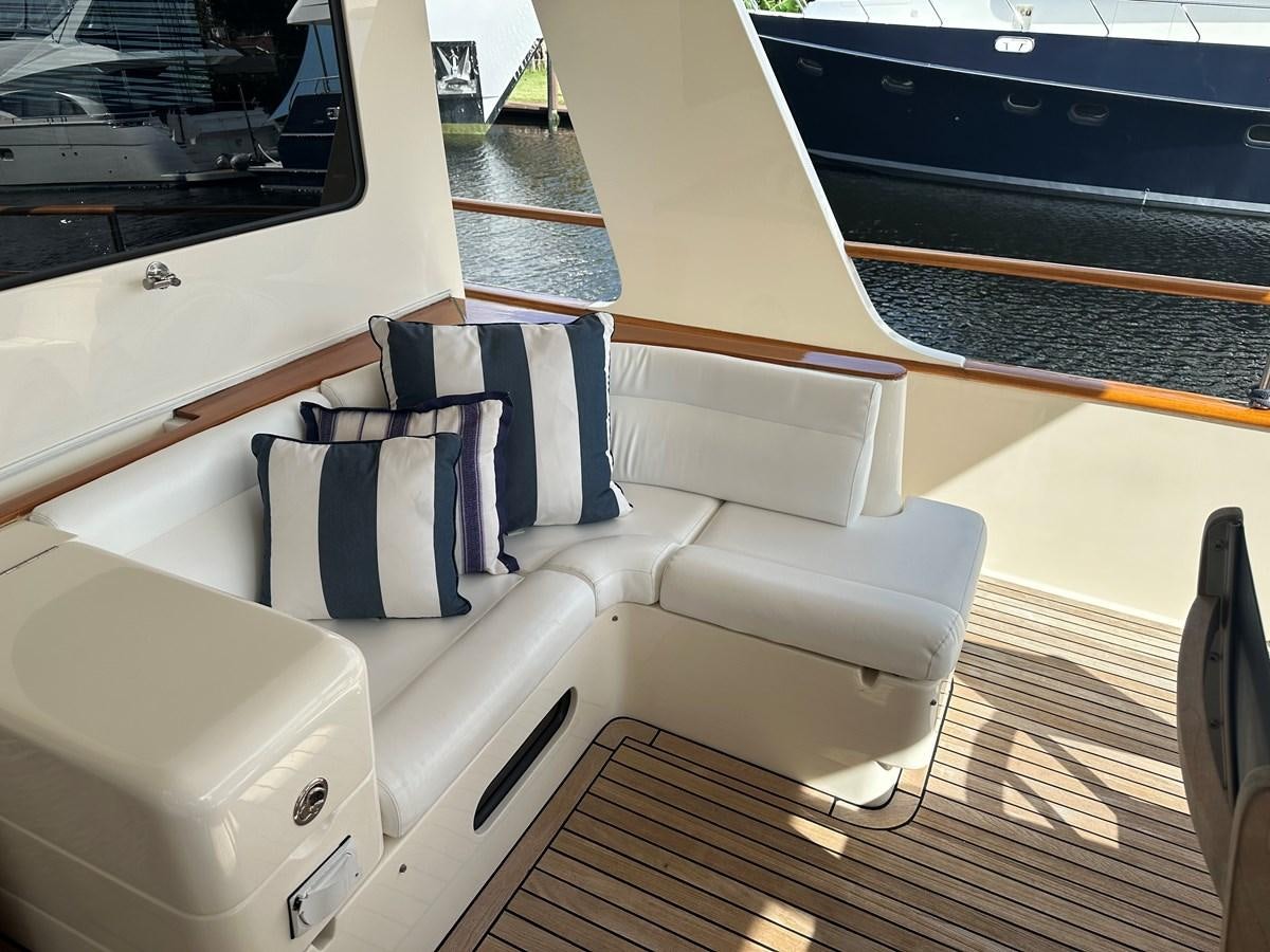 a white couch on a boat aboard BANDOL Yacht for Sale