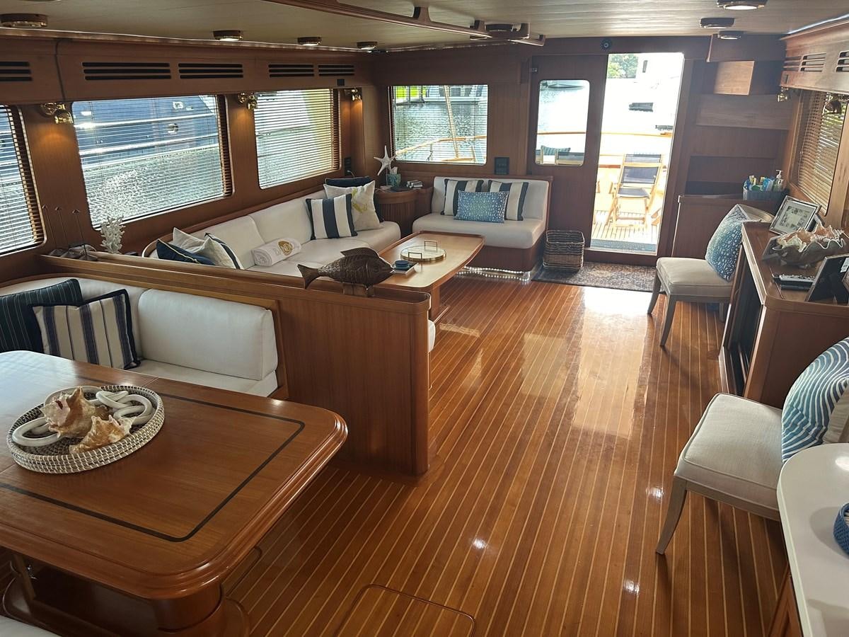 a living room with a wood floor aboard BANDOL Yacht for Sale