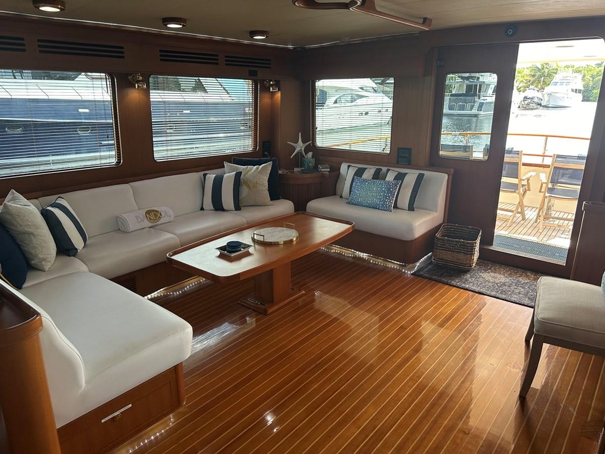 a living room with a couch and a table aboard BANDOL Yacht for Sale