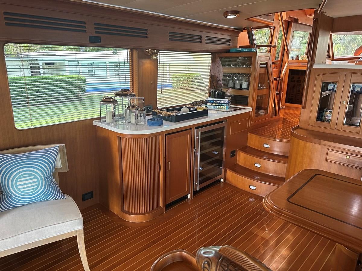 a kitchen with a large window aboard BANDOL Yacht for Sale