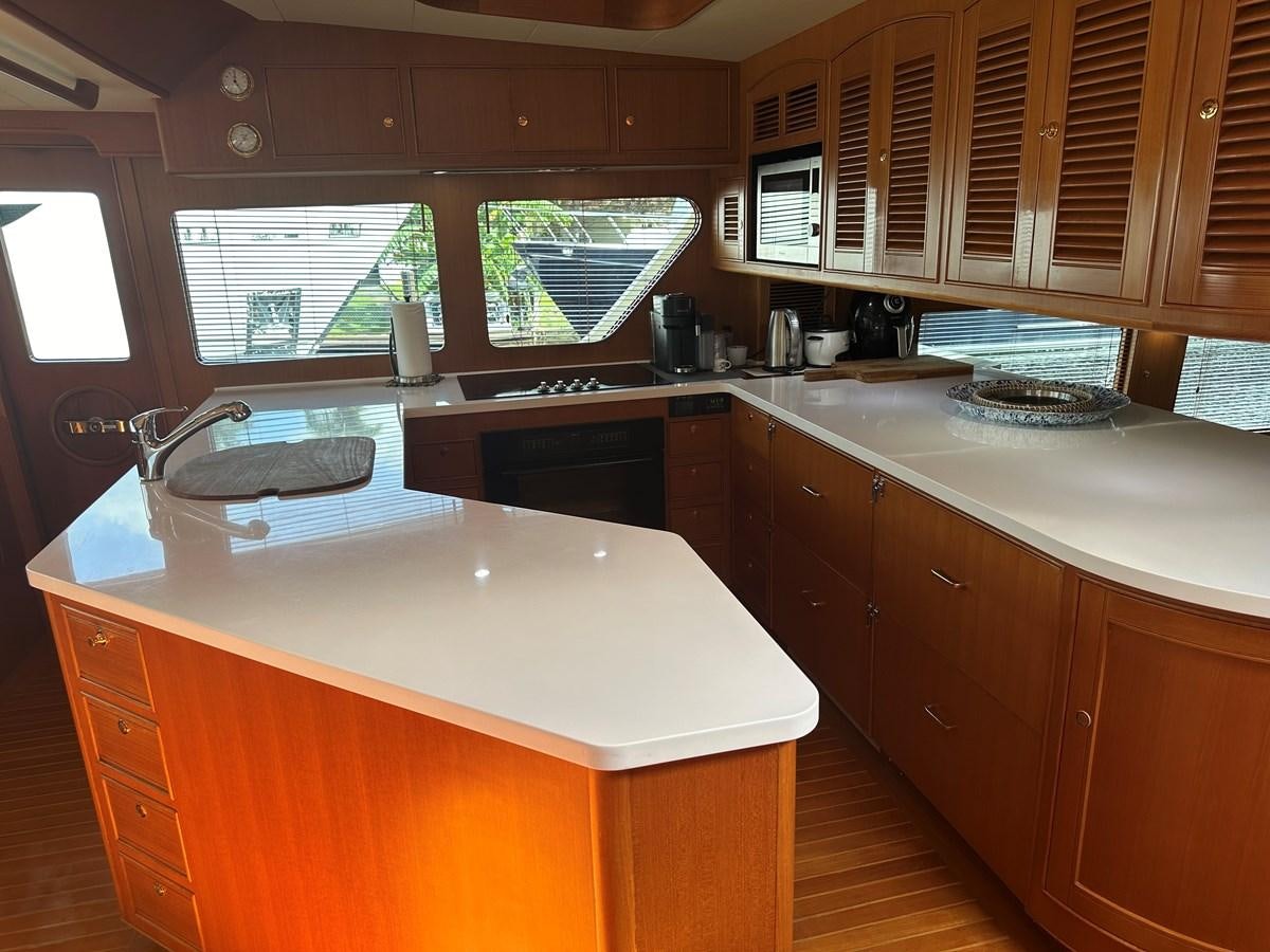 a kitchen with a large island aboard BANDOL Yacht for Sale