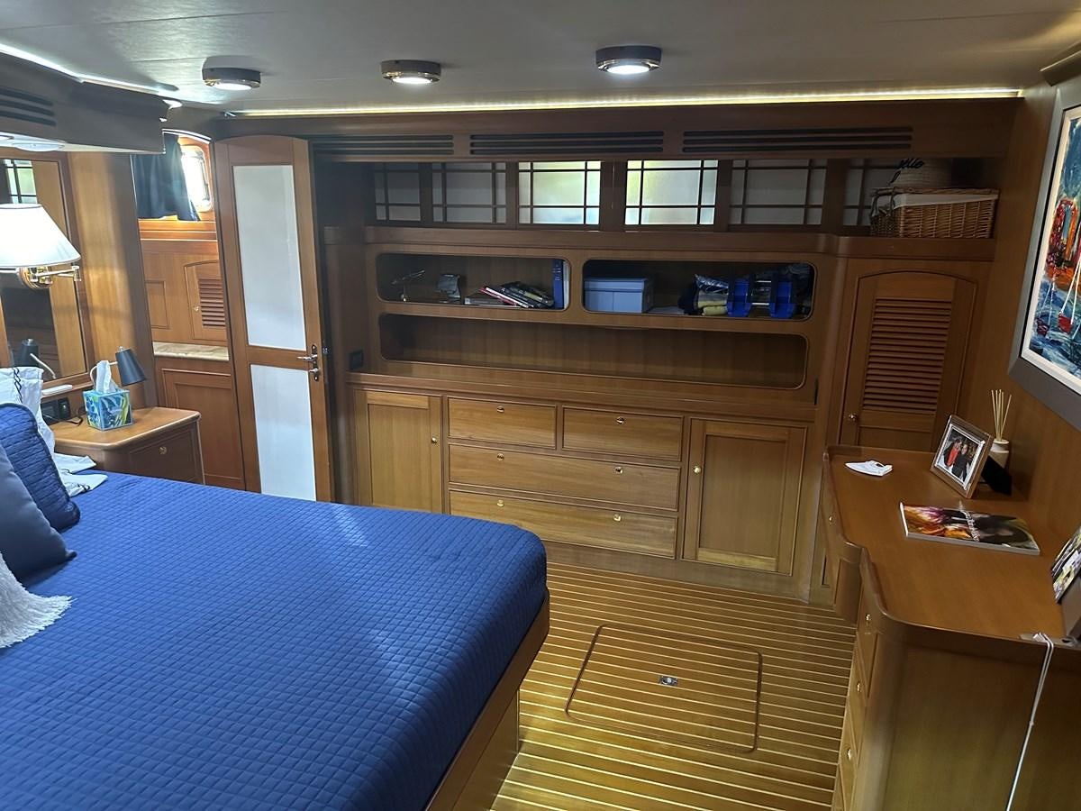 a room with a desk and a bed aboard BANDOL Yacht for Sale
