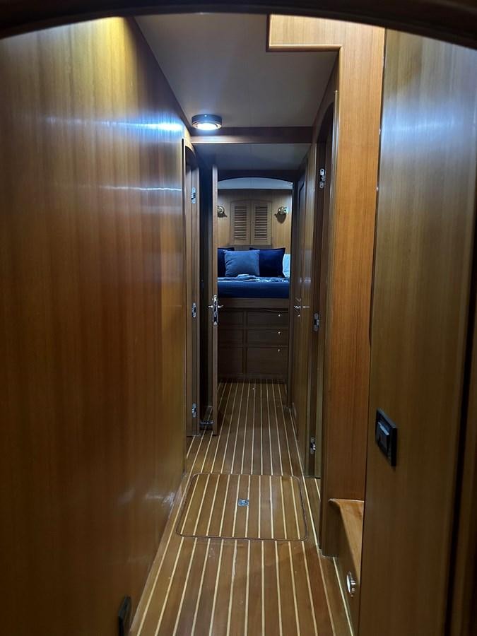 a hallway with a couch and a door aboard BANDOL Yacht for Sale