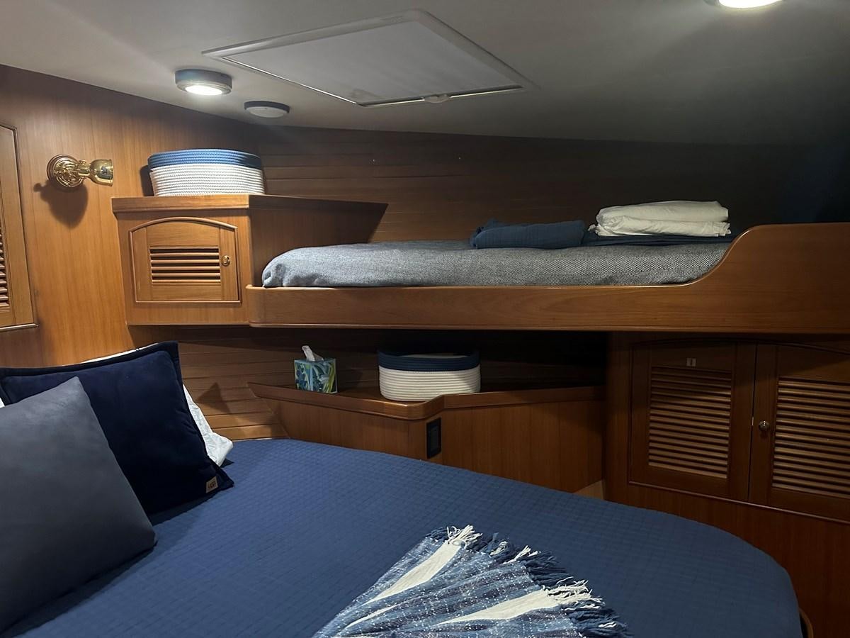 a room with a bed and a table aboard BANDOL Yacht for Sale