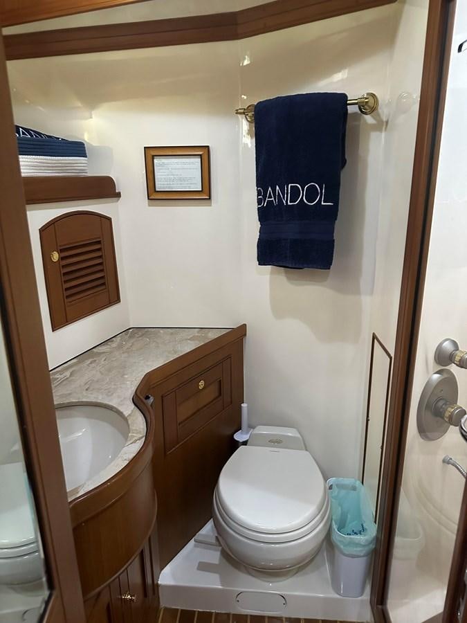 a bathroom with a toilet and sink aboard BANDOL Yacht for Sale