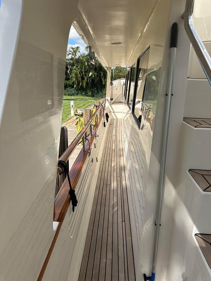 a long hallway with railings aboard BANDOL Yacht for Sale