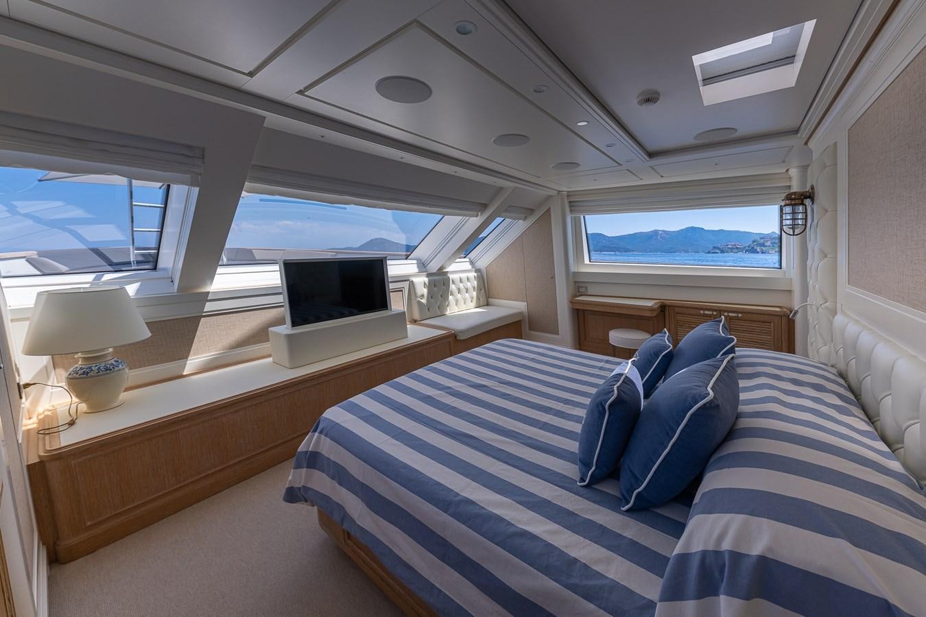 a room with a bed and a window aboard MY WAY Yacht for Sale