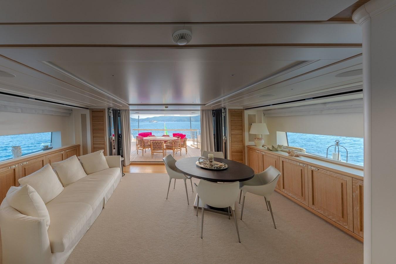a living room with a large window aboard MY WAY Yacht for Sale