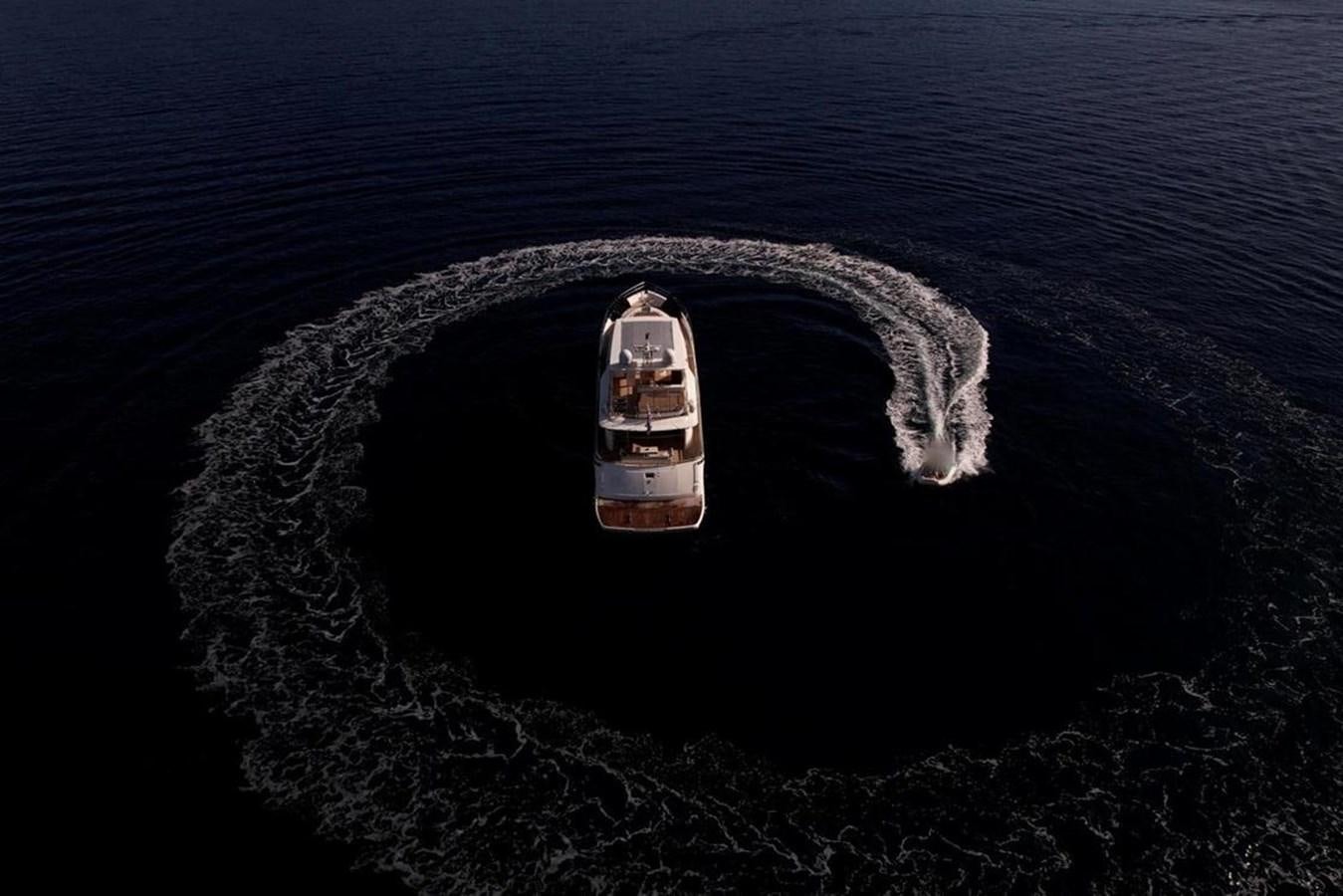 a car driving on a beach aboard SQUADRON 80 Yacht for Sale