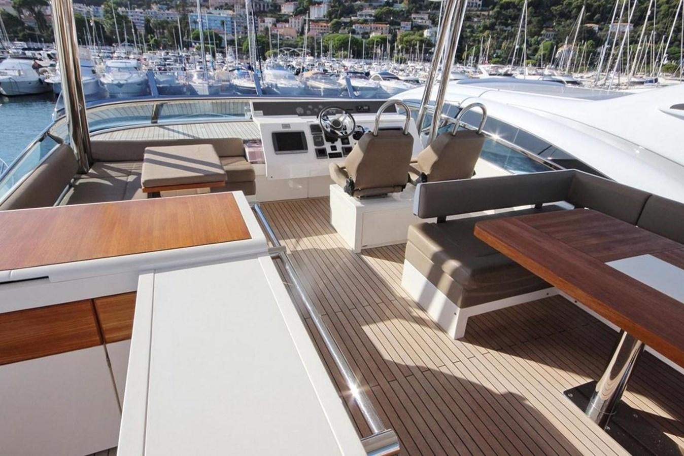 a boat with a deck and a deck with a deck and chairs aboard SQUADRON 80 Yacht for Sale