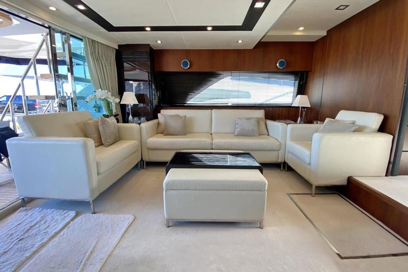 a living room with a large window aboard SQUADRON 80 Yacht for Sale