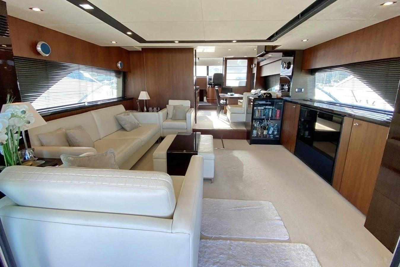 a living room with a couch and a table aboard SQUADRON 80 Yacht for Sale