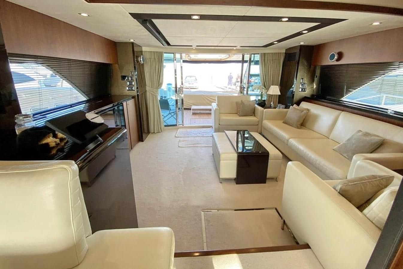 a living room with a large window aboard SQUADRON 80 Yacht for Sale
