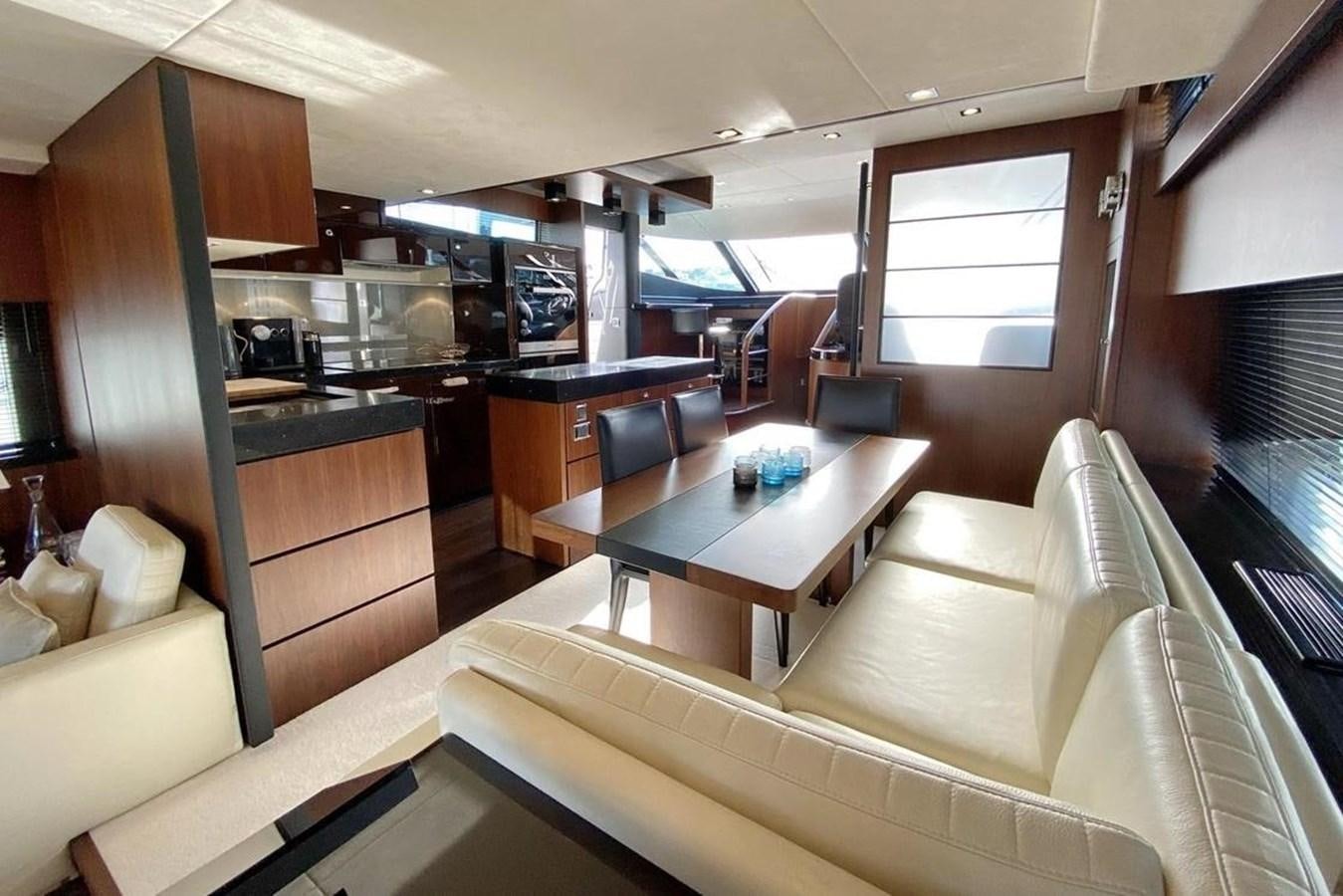 a room with a table and chairs aboard SQUADRON 80 Yacht for Sale