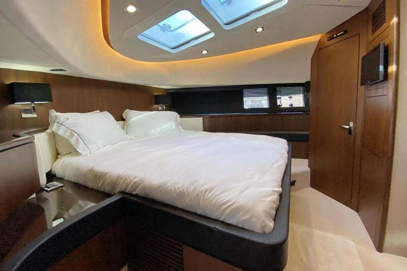 a room with a bed and a desk aboard SQUADRON 80 Yacht for Sale