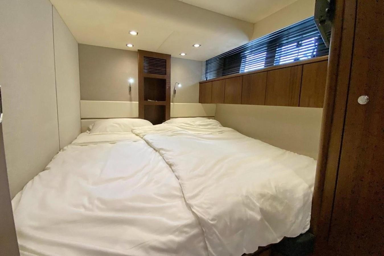 a bed with white sheets aboard SQUADRON 80 Yacht for Sale