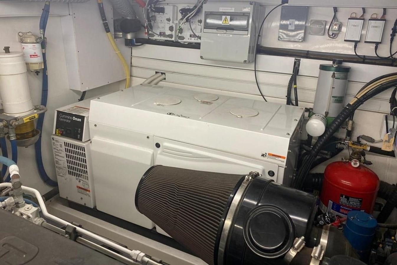 a white machine with a black cable aboard SQUADRON 80 Yacht for Sale