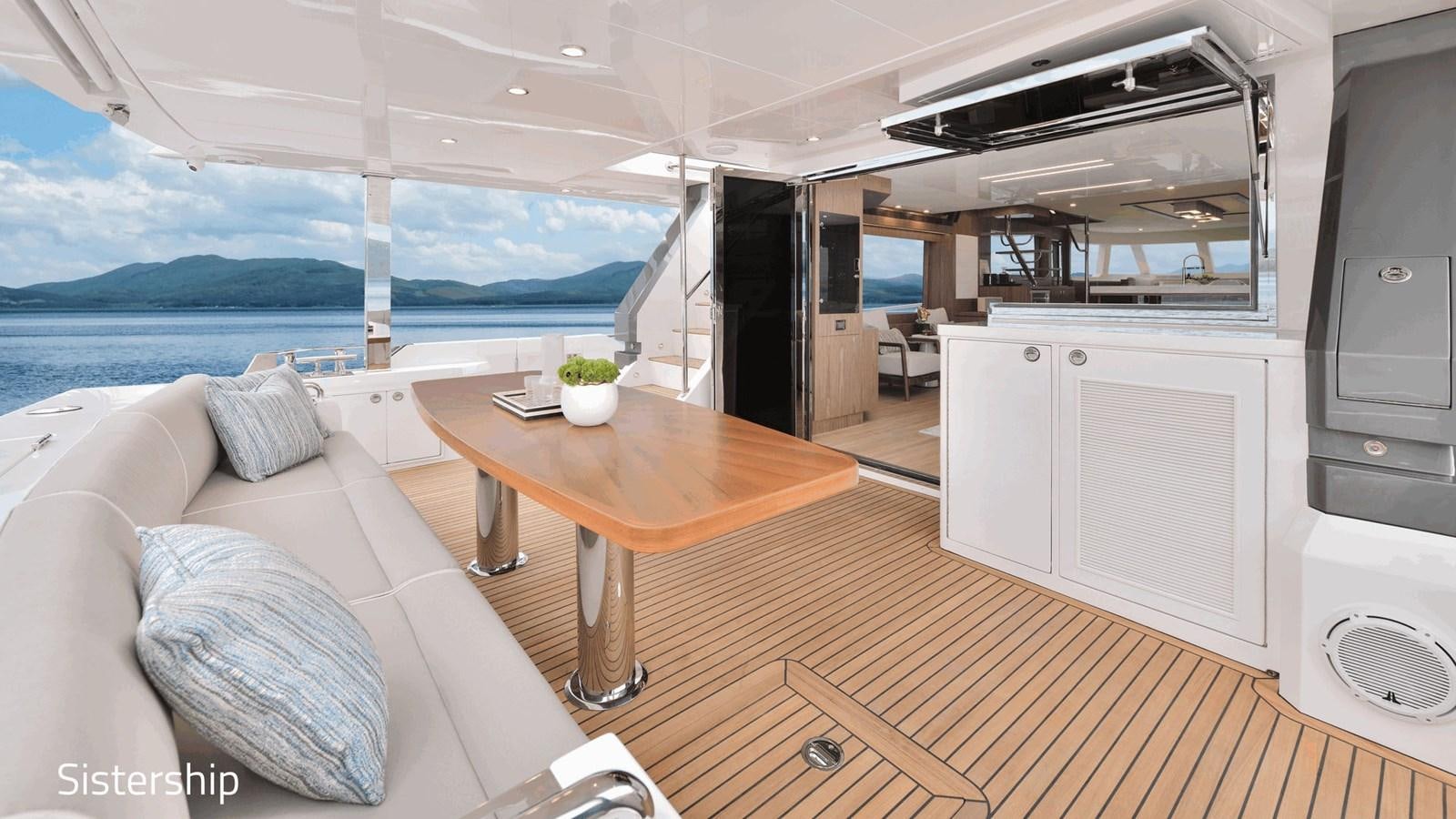 a living room with a couch and a table aboard HORIZON V68 Yacht for Sale