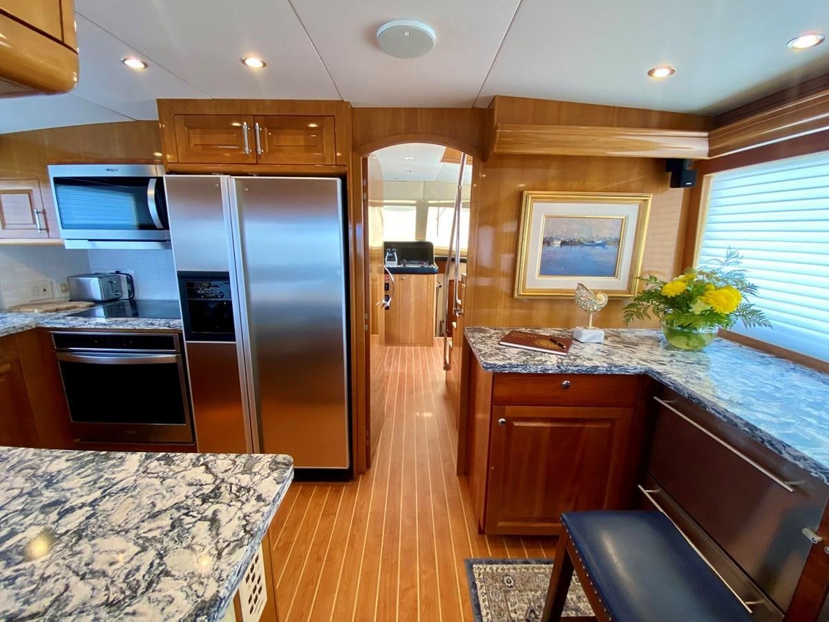 a kitchen with a large island aboard DREAM ON Yacht for Sale